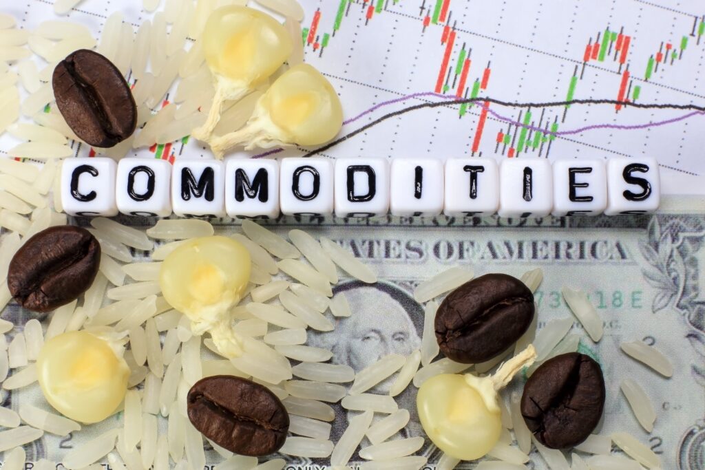 Coffee bean, rice, corn and letter cube on dollar and candle stick chart background - compressed