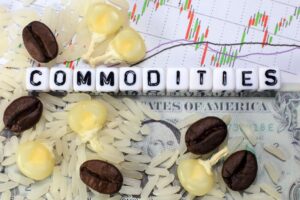 Coffee bean, rice, corn and letter cube on dollar and candle stick chart background - compressed