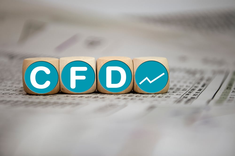 Dice with acronym CFD - Contracts For Difference on wooden background