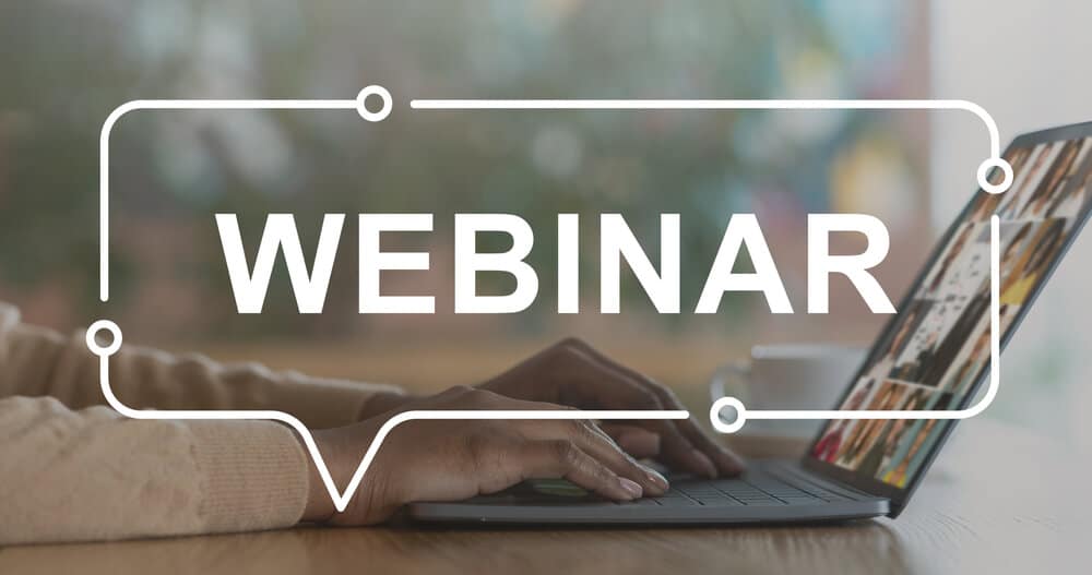 Female hands typing on laptop during Forex Webinar